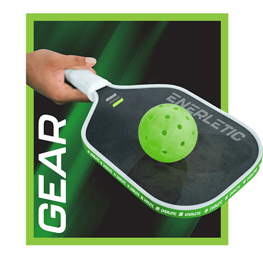 A hand holding a black Enerletic pickleball paddle, branded along the face and around the edge guard, with a green pickleball resting on it